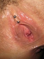 Glistening and hungry pussy with pierced clit